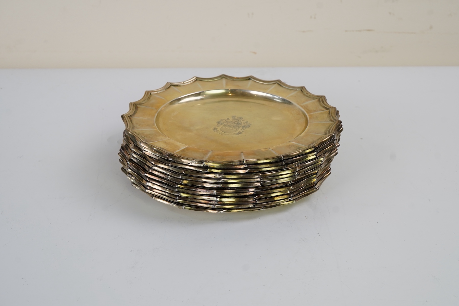 A set of twelve George V silver gilt side plates by J.S. Harman & Co